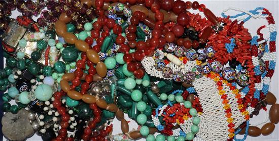 A group of assorted necklaces including agate, malachite and coral.